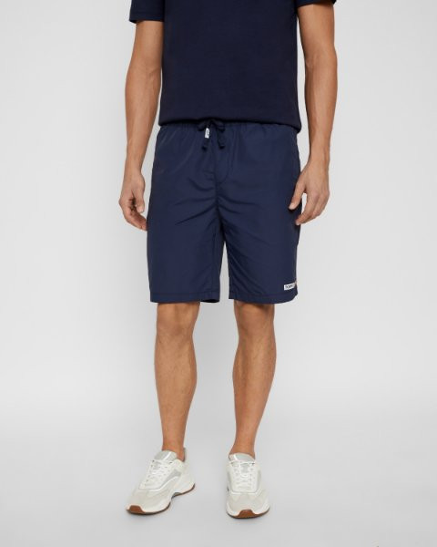 Tommy Jeans pánské tmavě modré kraťasy NYLON BASKETBALL SHORT č.1